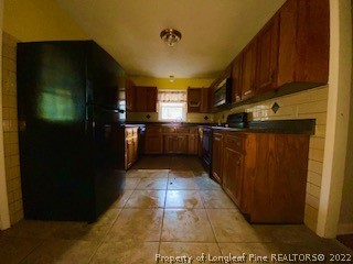 1416 Hibiscus Road Fayetteville, NC 28311 - Photo 4 of 16 a kitchen with stainless steel appliances granite countertop a refrigerator and a stove