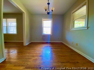 1416 Hibiscus Road Fayetteville, NC 28311 - Photo 6 of 16 a view of empty room with wooden floor and fan