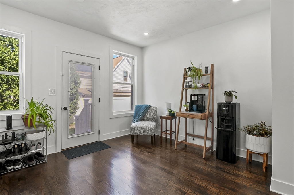 607 Cambridge Street, Unit 4 Worcester, MA 01610 - Photo 11 of 29 a living room with furniture and wooden floor