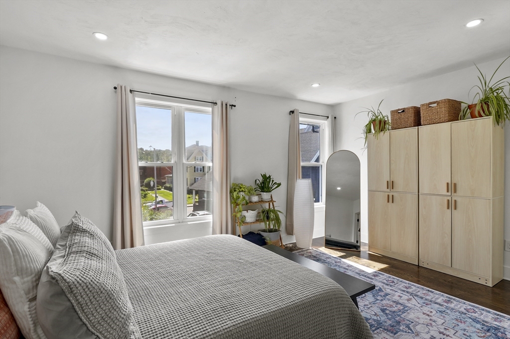 607 Cambridge Street, Unit 4 Worcester, MA 01610 - Photo 13 of 29 a bedroom with a large bed and a window