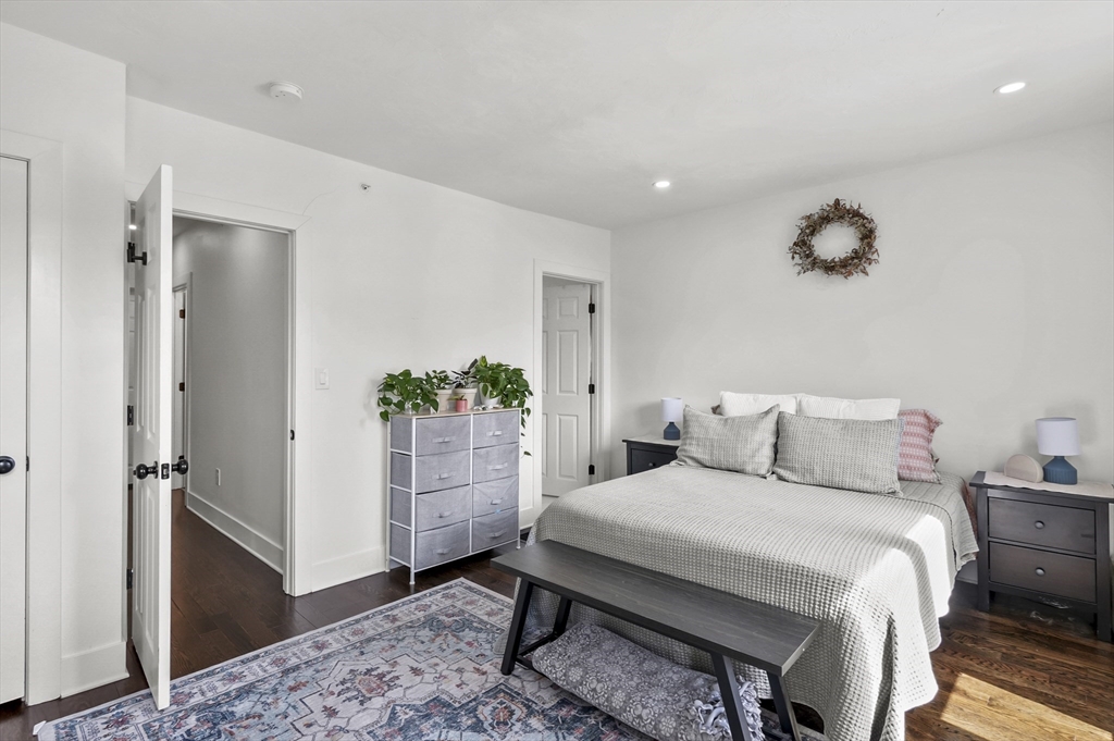 607 Cambridge Street, Unit 4 Worcester, MA 01610 - Photo 14 of 29 a bedroom with a bed and a potted plant