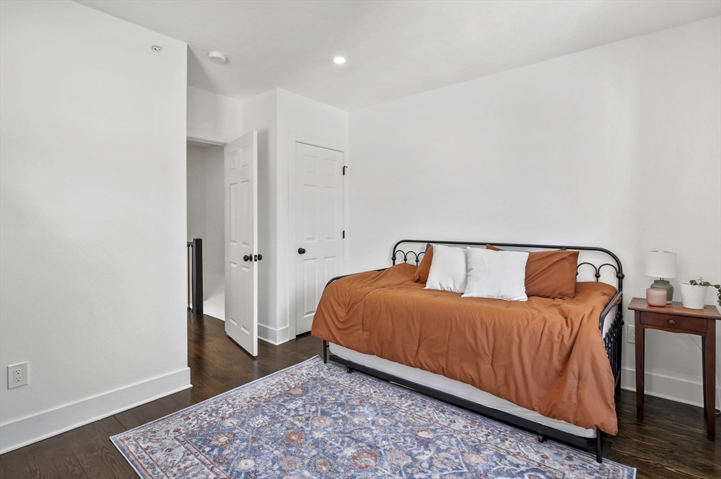 607 Cambridge Street, Unit 4 Worcester, MA 01610 - Photo 17 of 29 a bedroom with a bed and a window