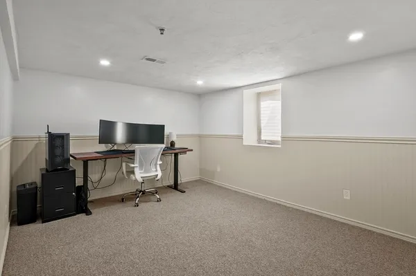 a view of a workspace with furniture