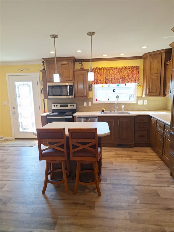 30 Topaz Terrace Gardner, MA 01440 - Photo 7 of 20 a kitchen with stainless steel appliances granite countertop table chairs sink and cabinets