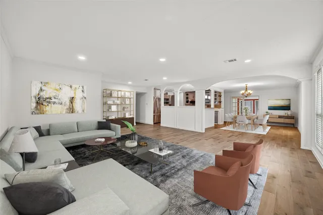 a living room with furniture or couch and a wooden floor