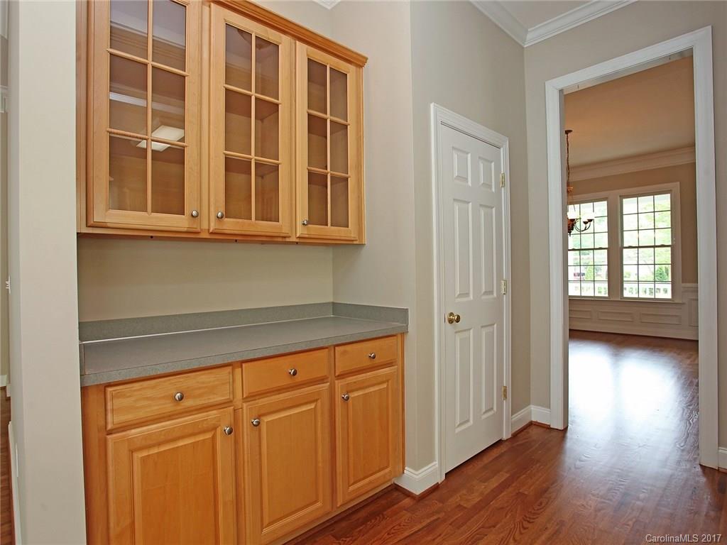 2416 Commons Court Fort Mill, SC 29708 - Photo 13 of 24 a view of a kitchen with wooden floor and cabinet