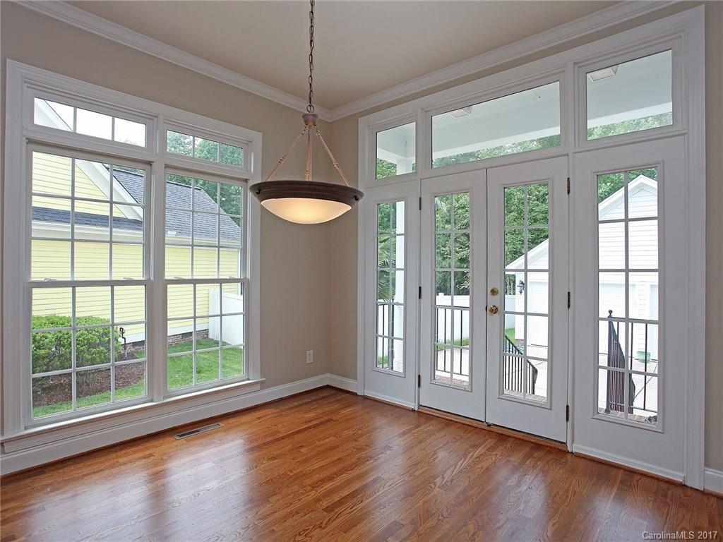 2416 Commons Court Fort Mill, SC 29708 - Photo 16 of 24 a view of an empty room with wooden floor and a window