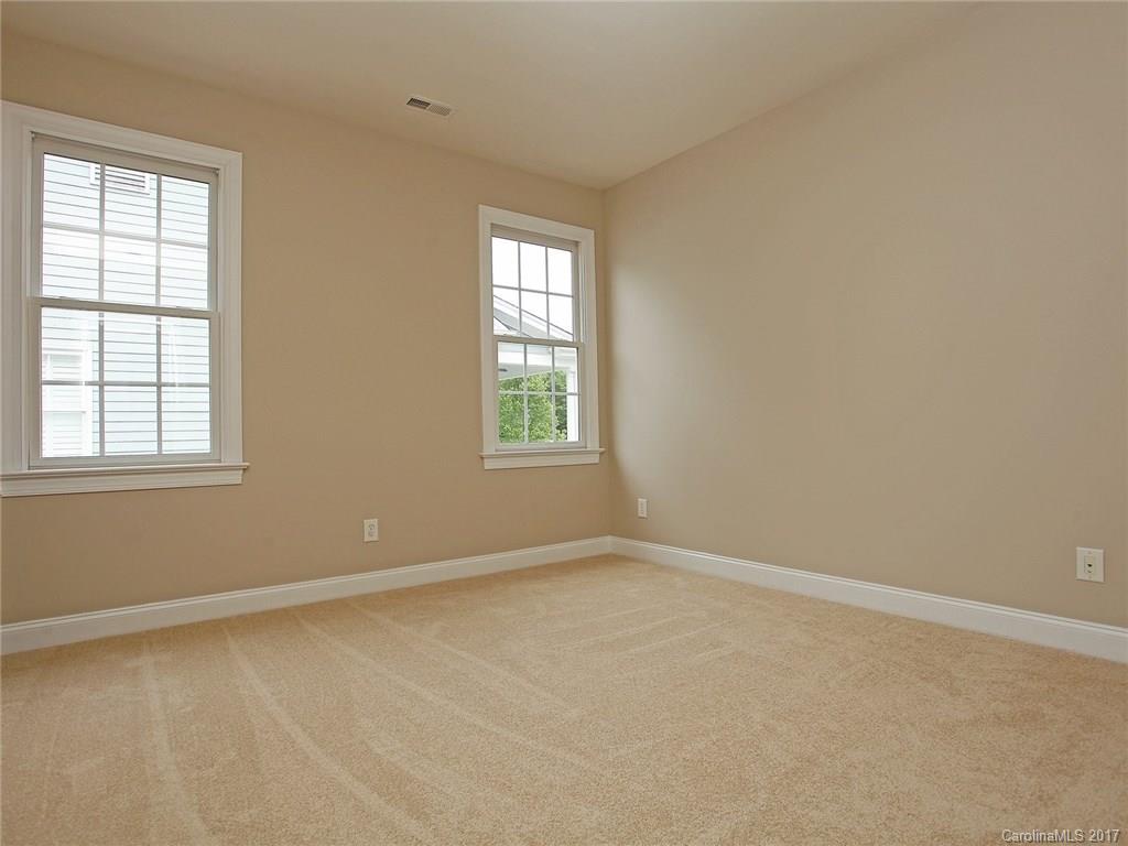 2416 Commons Court Fort Mill, SC 29708 - Photo 19 of 24 an empty room with windows