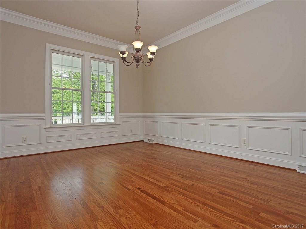 2416 Commons Court Fort Mill, SC 29708 - Photo 9 of 24 a view of an empty room with wooden floor and a window