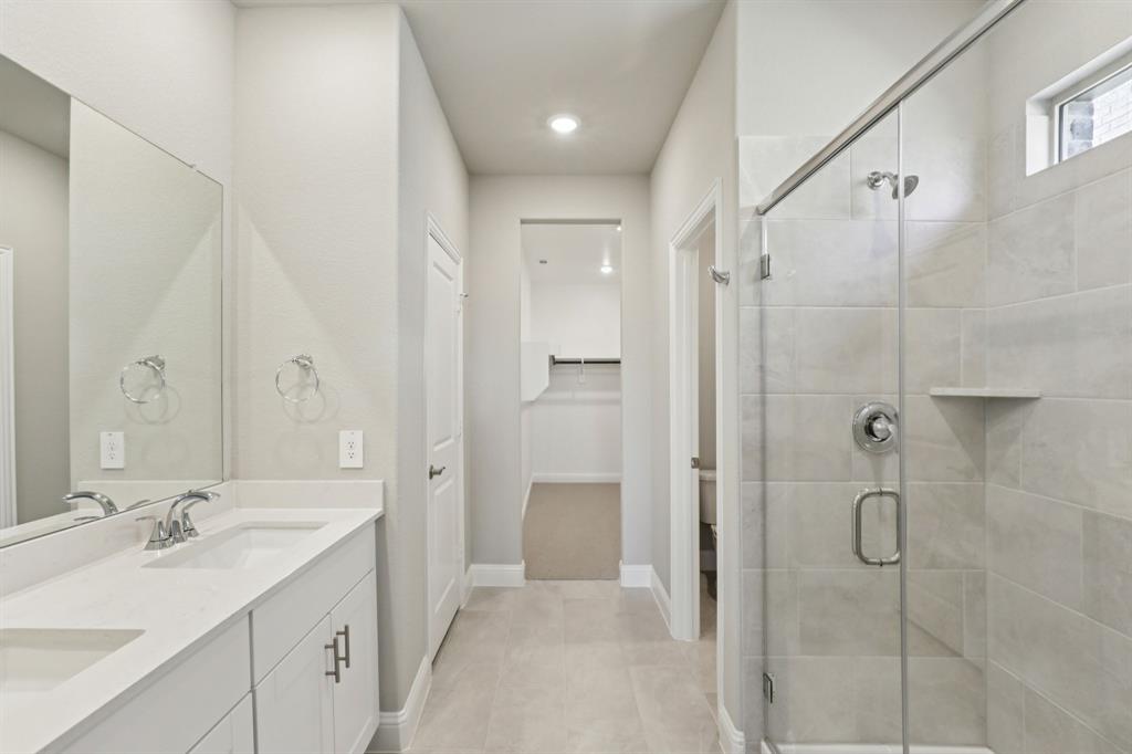 1729 Arches Road Anna, TX 75409 - Photo 14 of 27 a bathroom with a double vanity sink shower and mirror