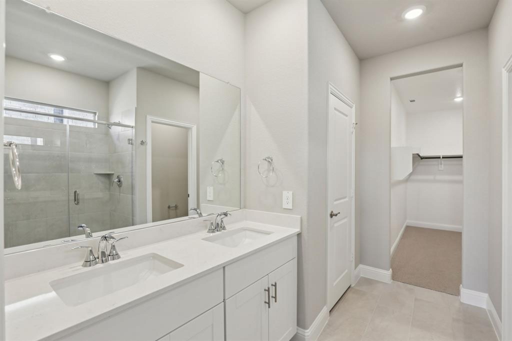 1729 Arches Road Anna, TX 75409 - Photo 15 of 27 a bathroom with a double vanity sink mirror and shower