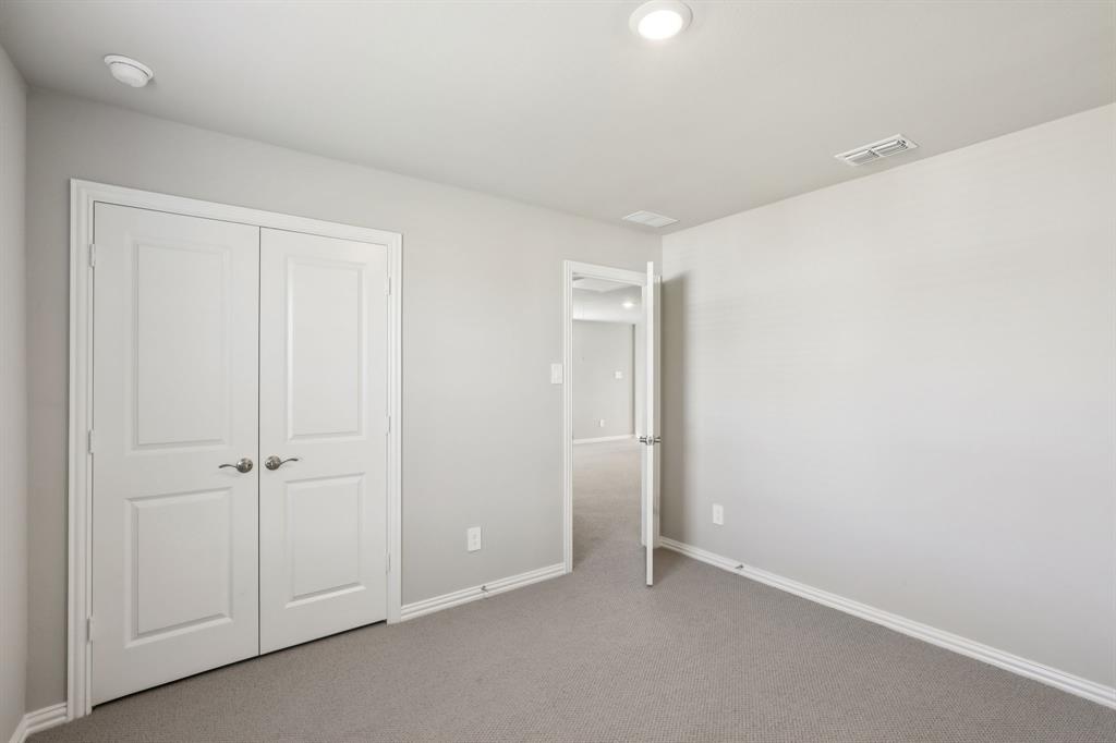 1729 Arches Road Anna, TX 75409 - Photo 23 of 27 an empty room with closet area