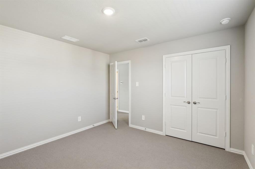 1729 Arches Road Anna, TX 75409 - Photo 25 of 27 an empty room with closet area