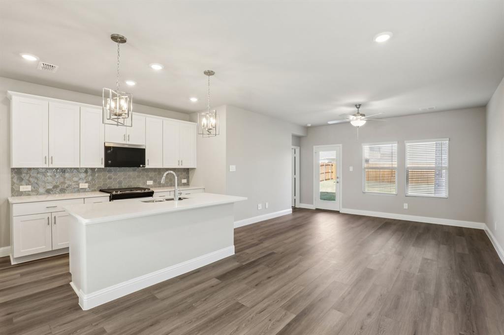 1729 Arches Road Anna, TX 75409 - Photo 3 of 27 a view of kitchen with sink microwave and stove