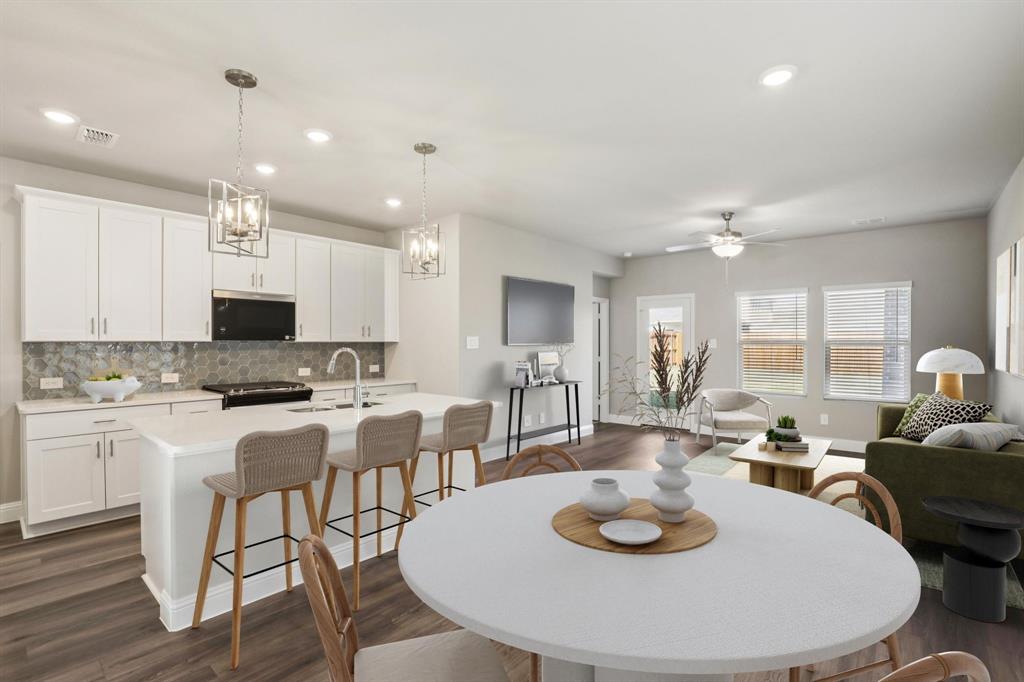 1729 Arches Road Anna, TX 75409 - Photo 4 of 27 a large kitchen with a table and chairs