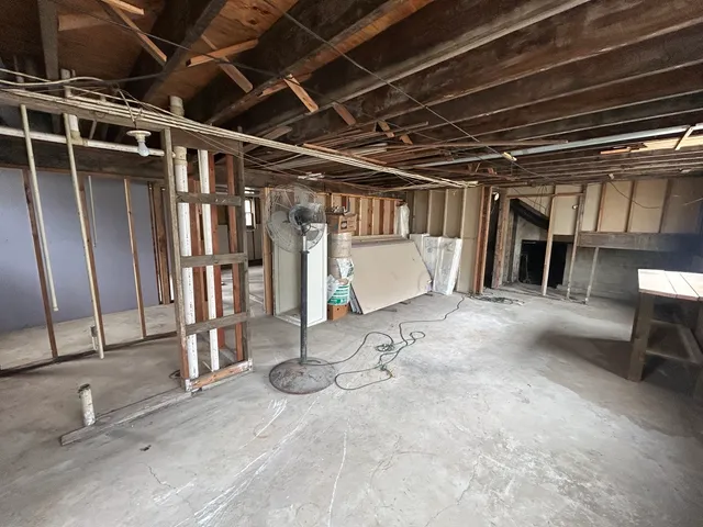 a room with lots of wooden cabinets