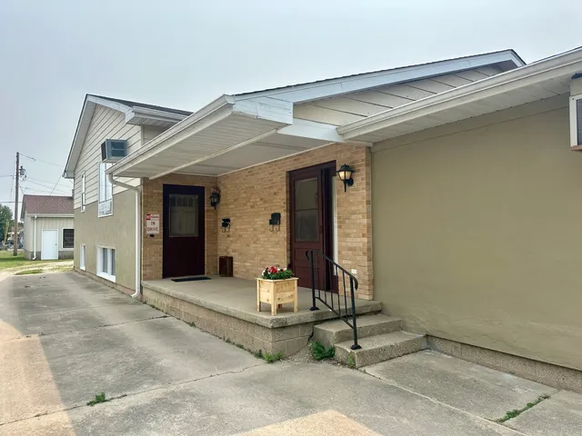 a front view of a house with a porch