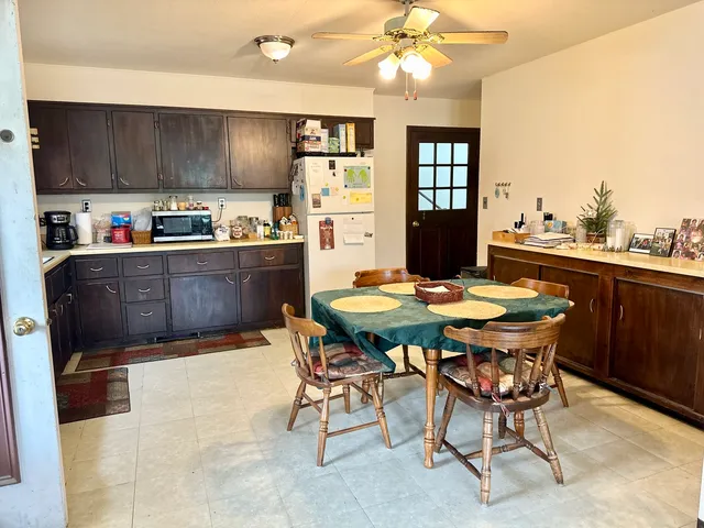 a kitchen with a table and chairs in it