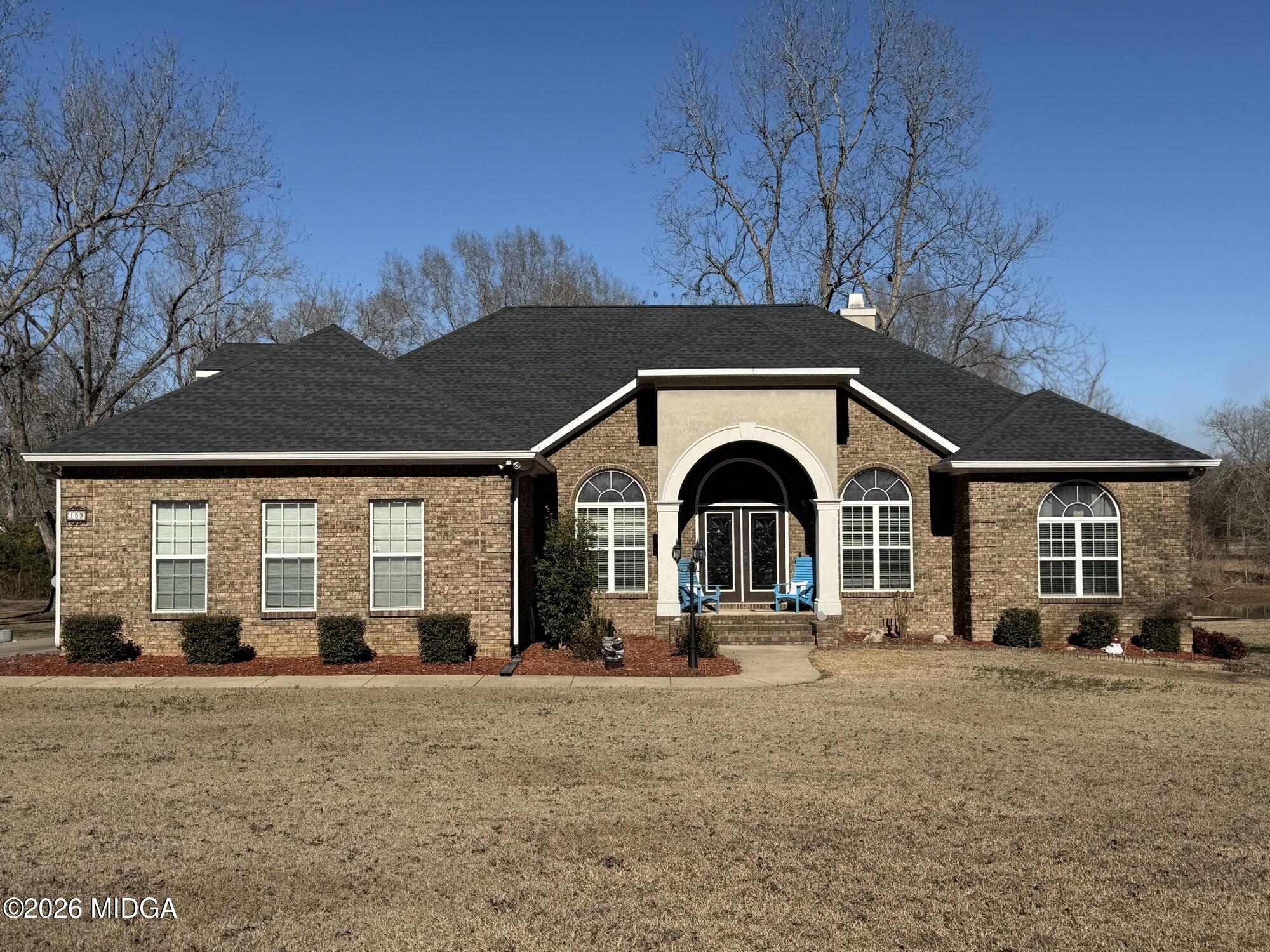 a front view of a house with a yard