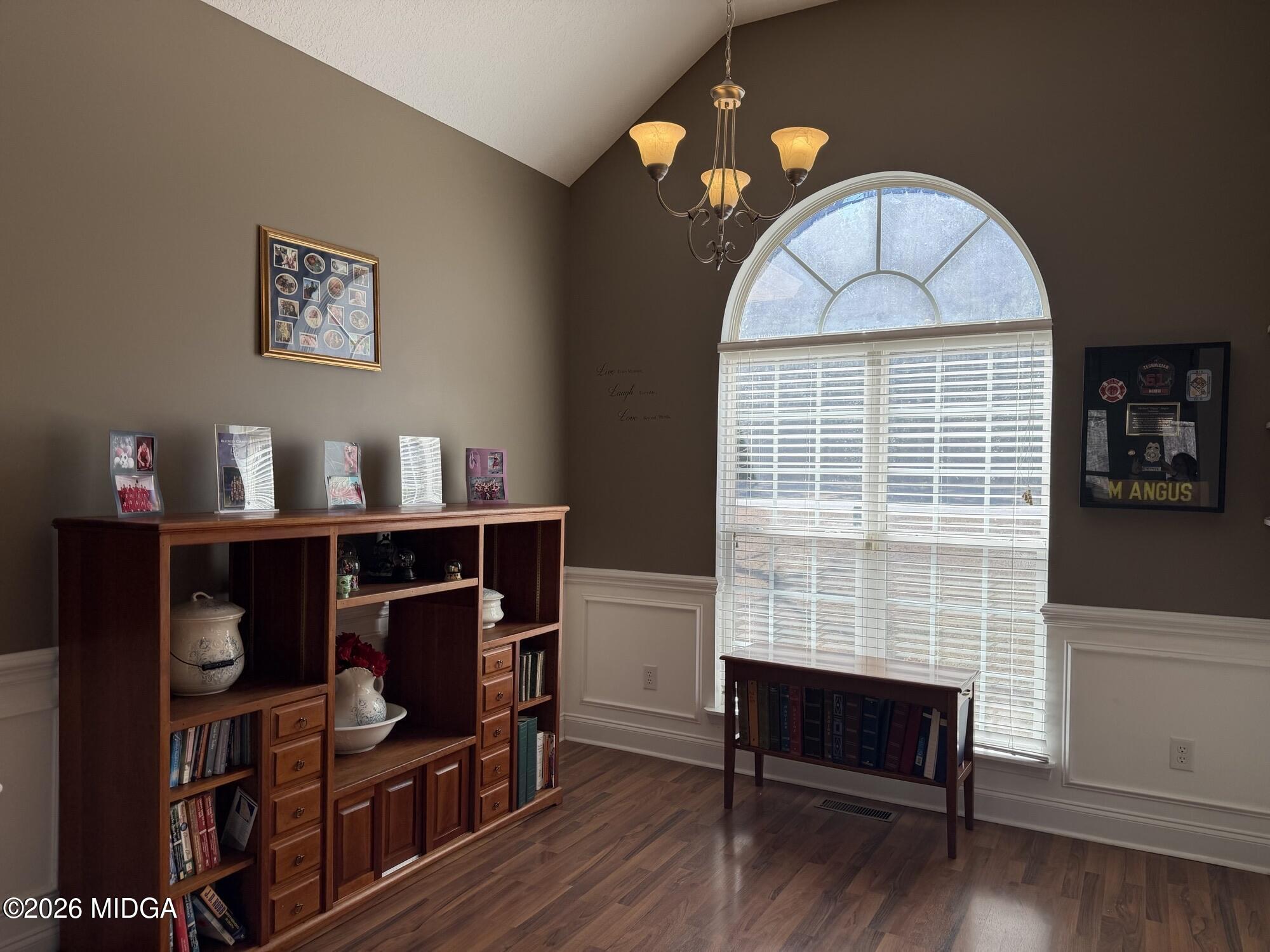 159 Jockey Lane Cochran, GA 31014 - Photo 11 of 39 a view of workspace with wooden floor and book shelf