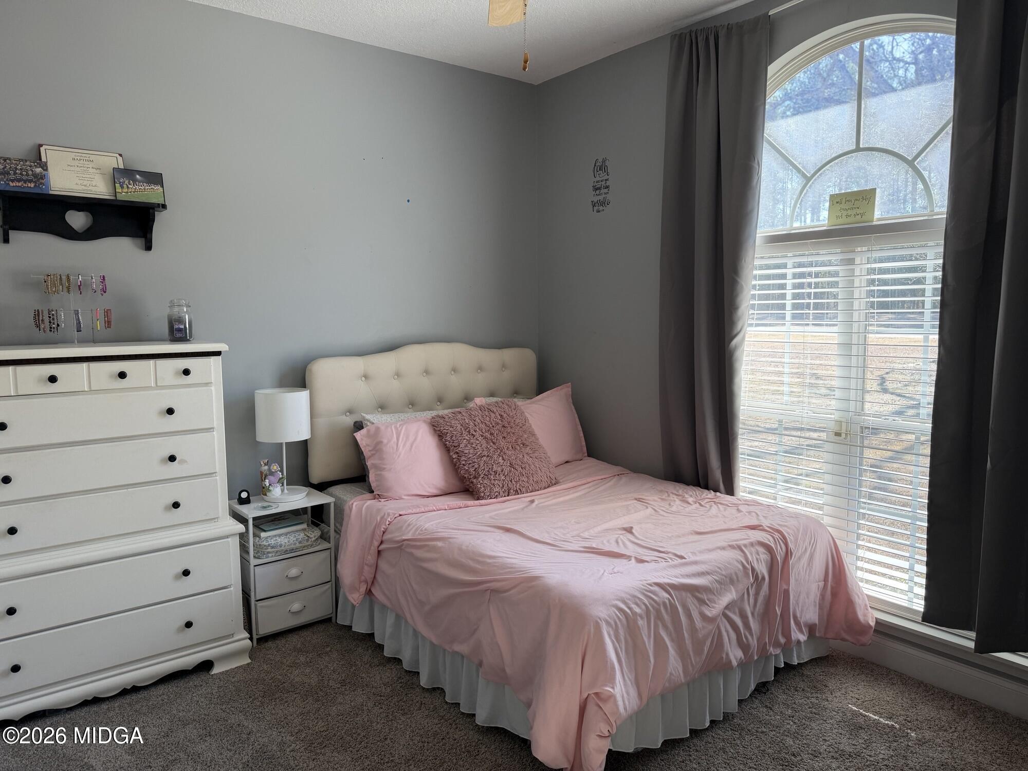 159 Jockey Lane Cochran, GA 31014 - Photo 18 of 39 a bedroom with a bed and a window