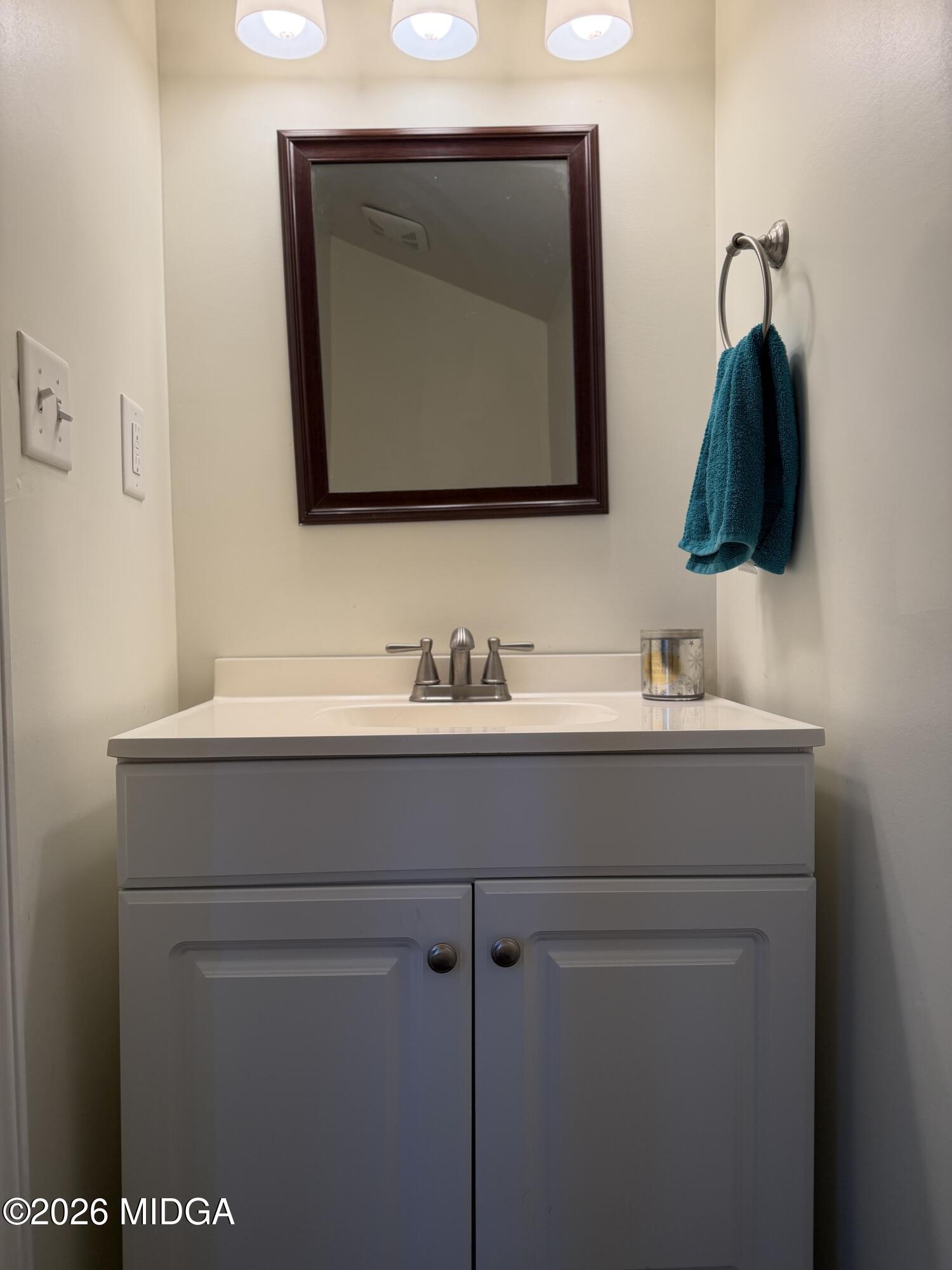 159 Jockey Lane Cochran, GA 31014 - Photo 26 of 39 a bathroom with a sink vanity and mirror