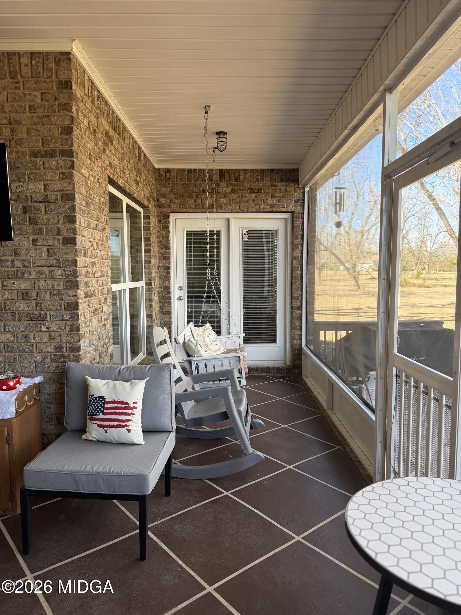 159 Jockey Lane Cochran, GA 31014 - Photo 28 of 39 a balcony with furniture and a potted plant