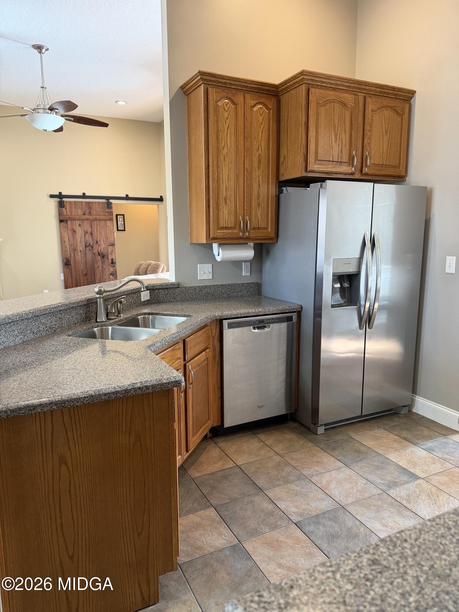 159 Jockey Lane Cochran, GA 31014 - Photo 6 of 39 a kitchen with stainless steel appliances granite countertop a sink a refrigerator and a stove