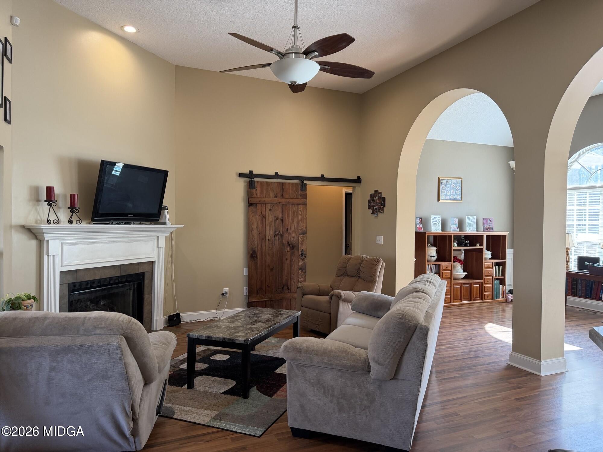 159 Jockey Lane Cochran, GA 31014 - Photo 9 of 39 a living room with furniture fireplace and a flat screen tv
