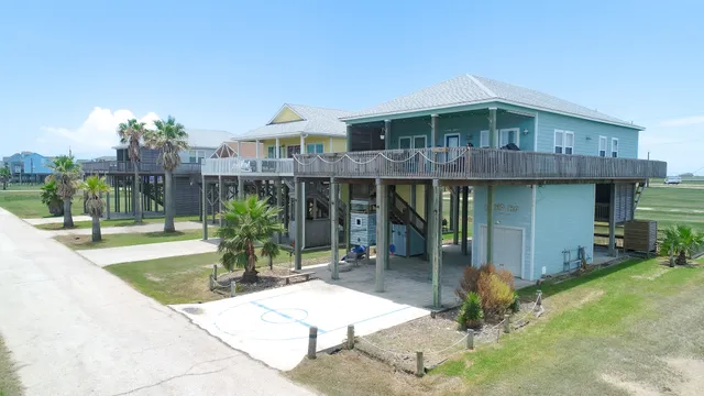 a view of a house with backyard porch and sitting area