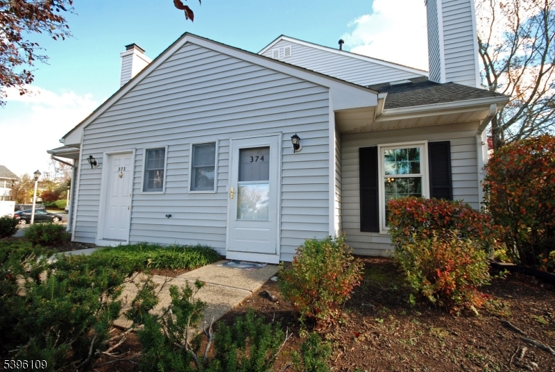 374 Burdock Court Three Bridges, NJ 08887 - Photo 1 of 16 a view of a house with a small yard and plants
