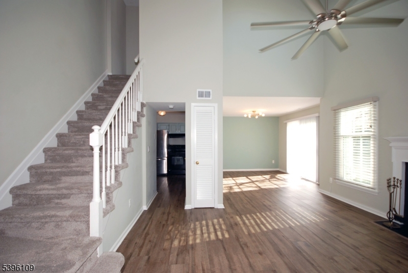 374 Burdock Court Three Bridges, NJ 08887 - Photo 3 of 16 a view of an empty room with wooden floor and a window