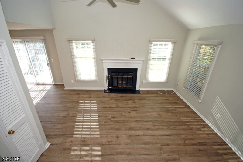 374 Burdock Court Three Bridges, NJ 08887 - Photo 4 of 16 a view of a livingroom with wooden floor and a fireplace