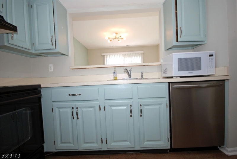 374 Burdock Court Three Bridges, NJ 08887 - Photo 9 of 16 a kitchen with cabinets appliances and a sink