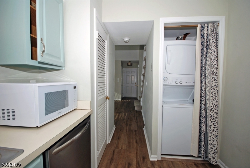 374 Burdock Court Three Bridges, NJ 08887 - Photo 10 of 16 a view of a hallway with wooden floor and staircase