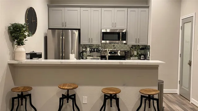 a kitchen with a table and chairs