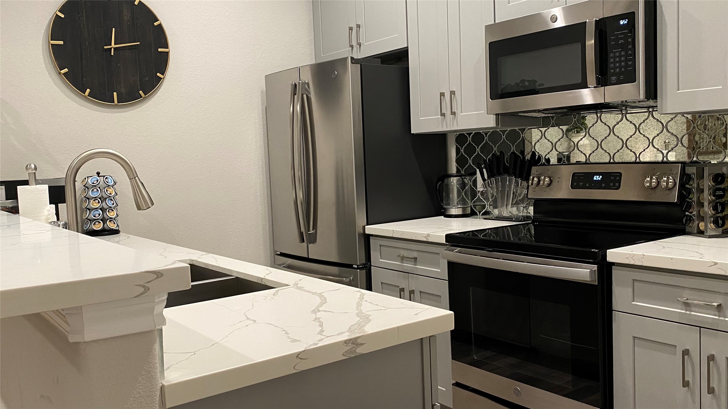 3144 Southmore Boulevard, Unit 4 Houston, TX 77004 - Photo 4 of 10 a kitchen with stainless steel appliances a stove microwave and refrigerator