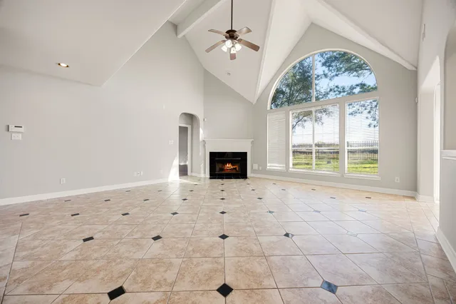 a view of a kitchen with granite countertop cabinets and a fireplace