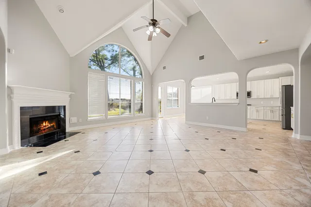 a view of a hallway with cabinet and mirrors