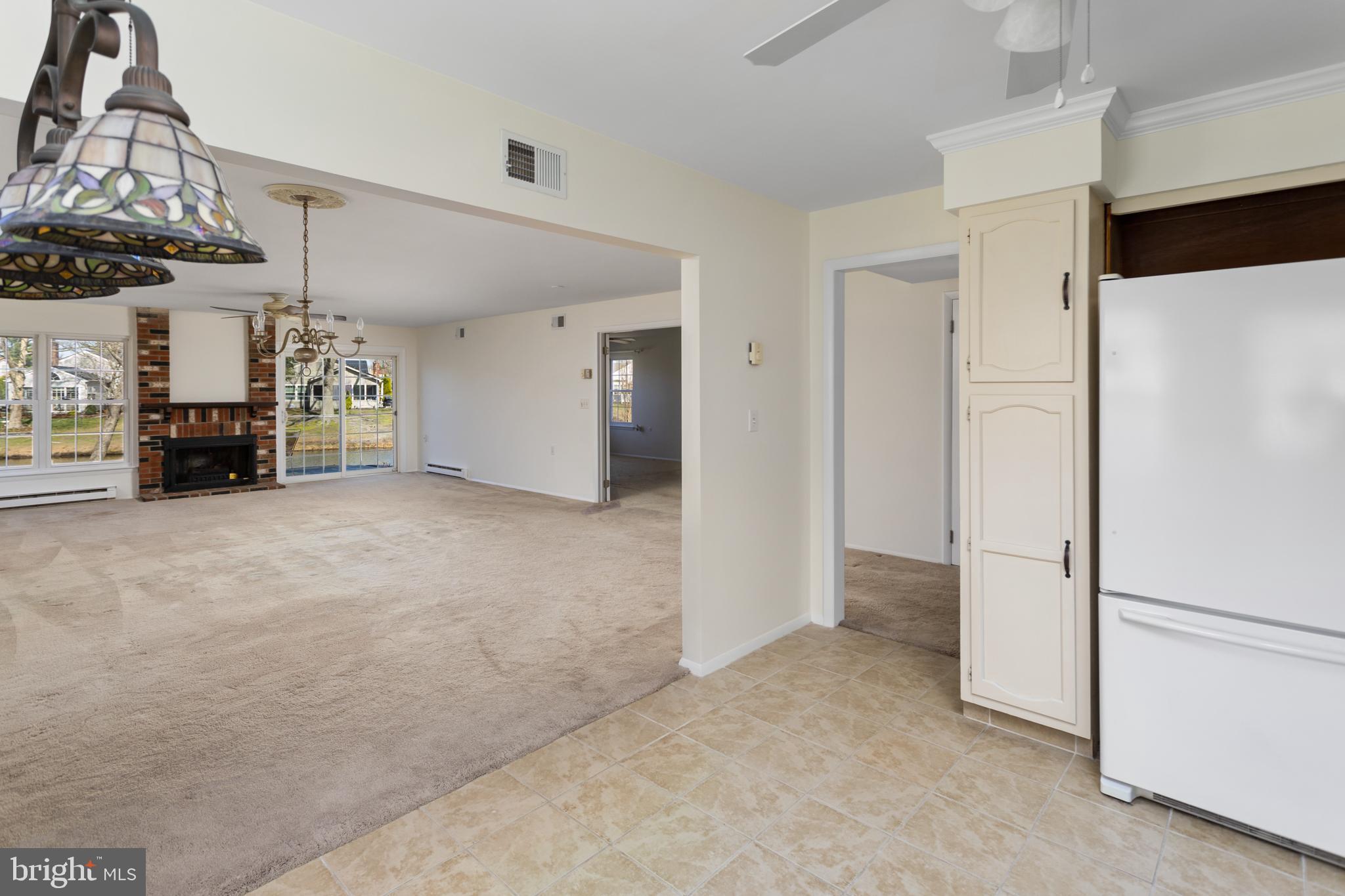 40 Dunstable Road Southampton, NJ 08088 - Photo 13 of 30 a view of a livingroom with furniture and a refrigerator