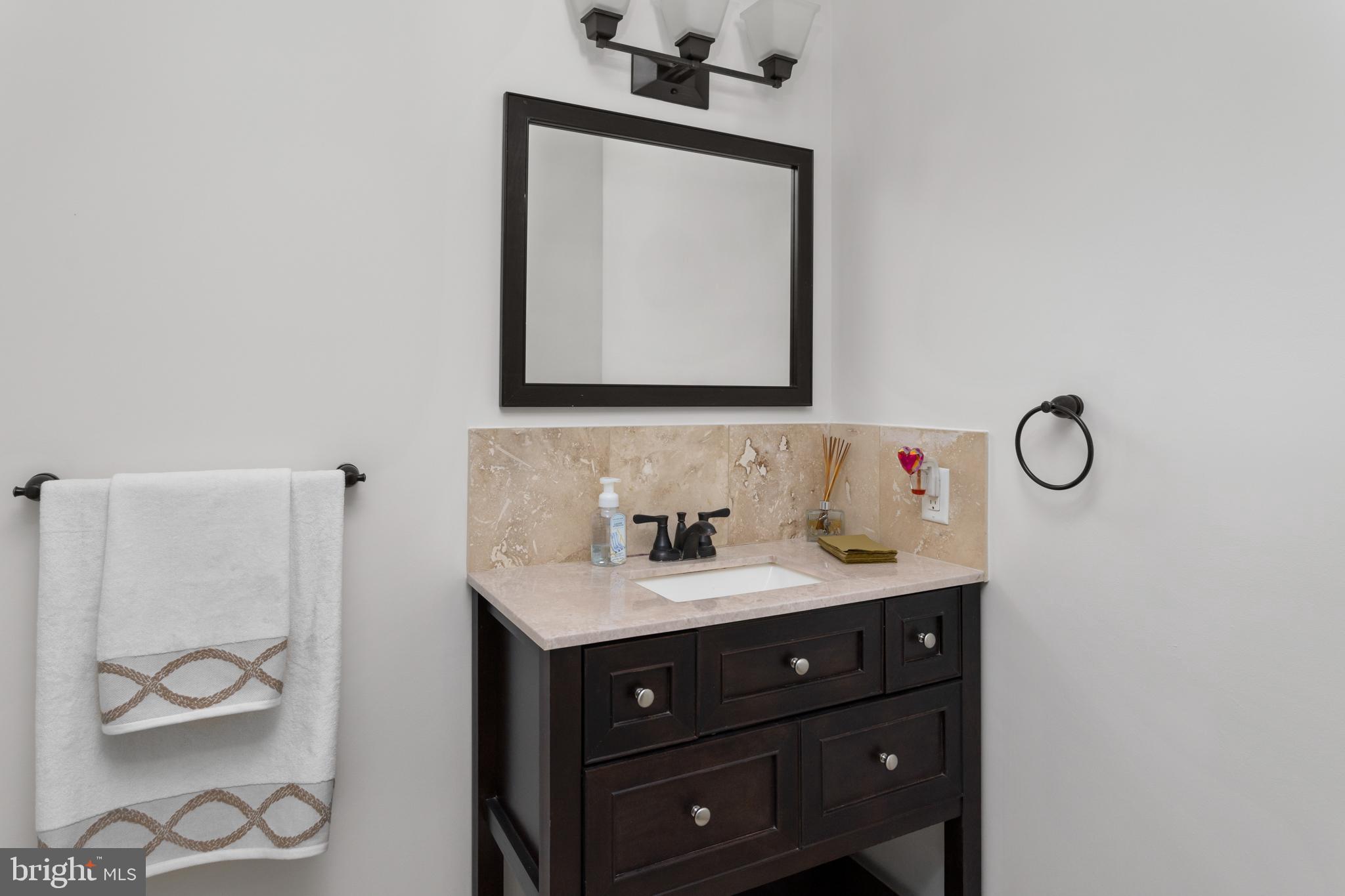 40 Dunstable Road Southampton, NJ 08088 - Photo 16 of 30 a bathroom with a sink vanity and a mirror