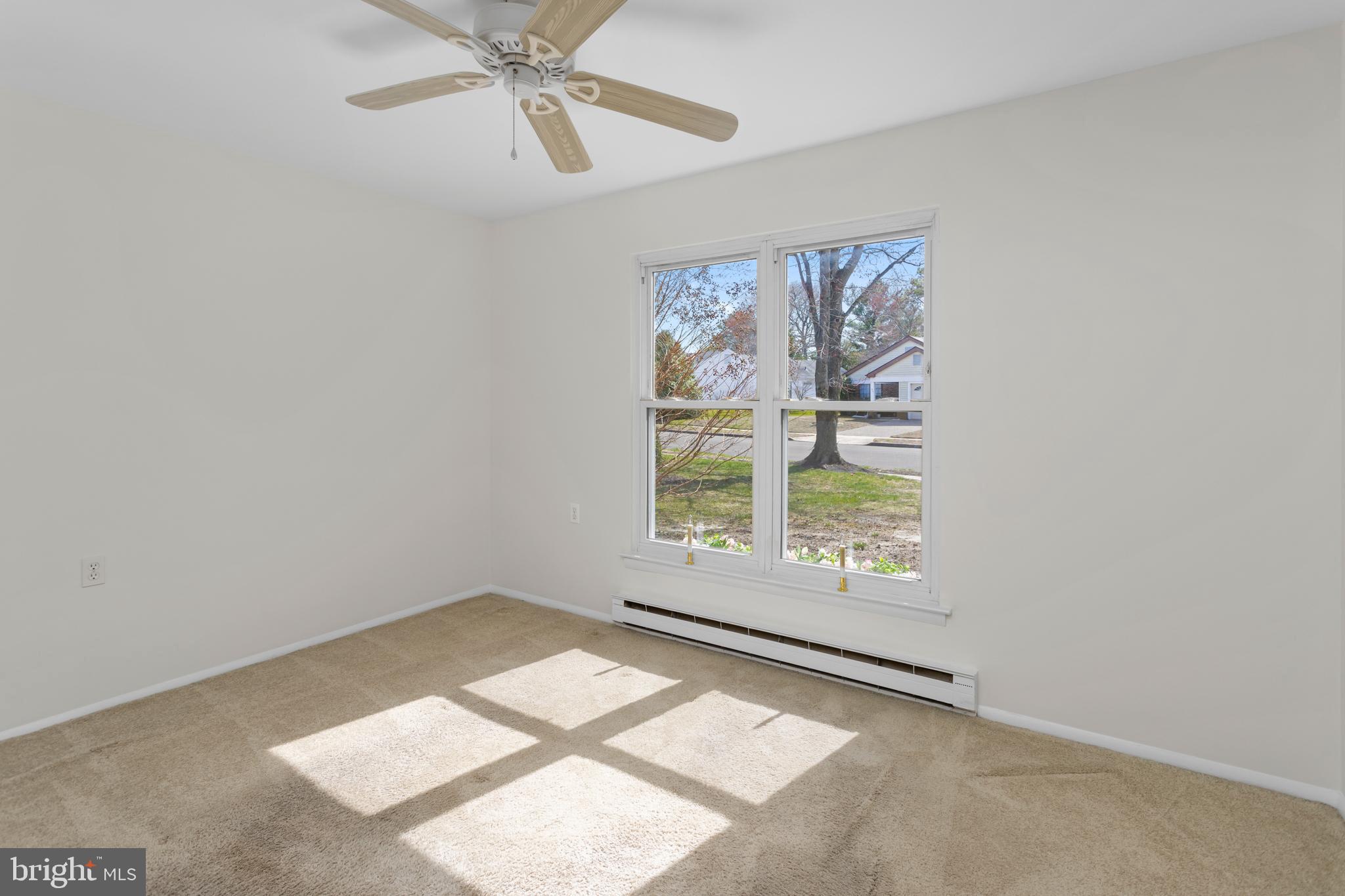 40 Dunstable Road Southampton, NJ 08088 - Photo 18 of 30 an empty room with a window and ceiling fan