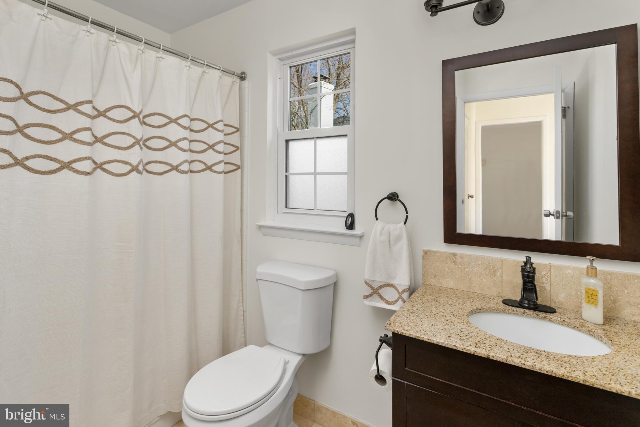 40 Dunstable Road Southampton, NJ 08088 - Photo 20 of 30 a bathroom with a granite countertop sink and a mirror