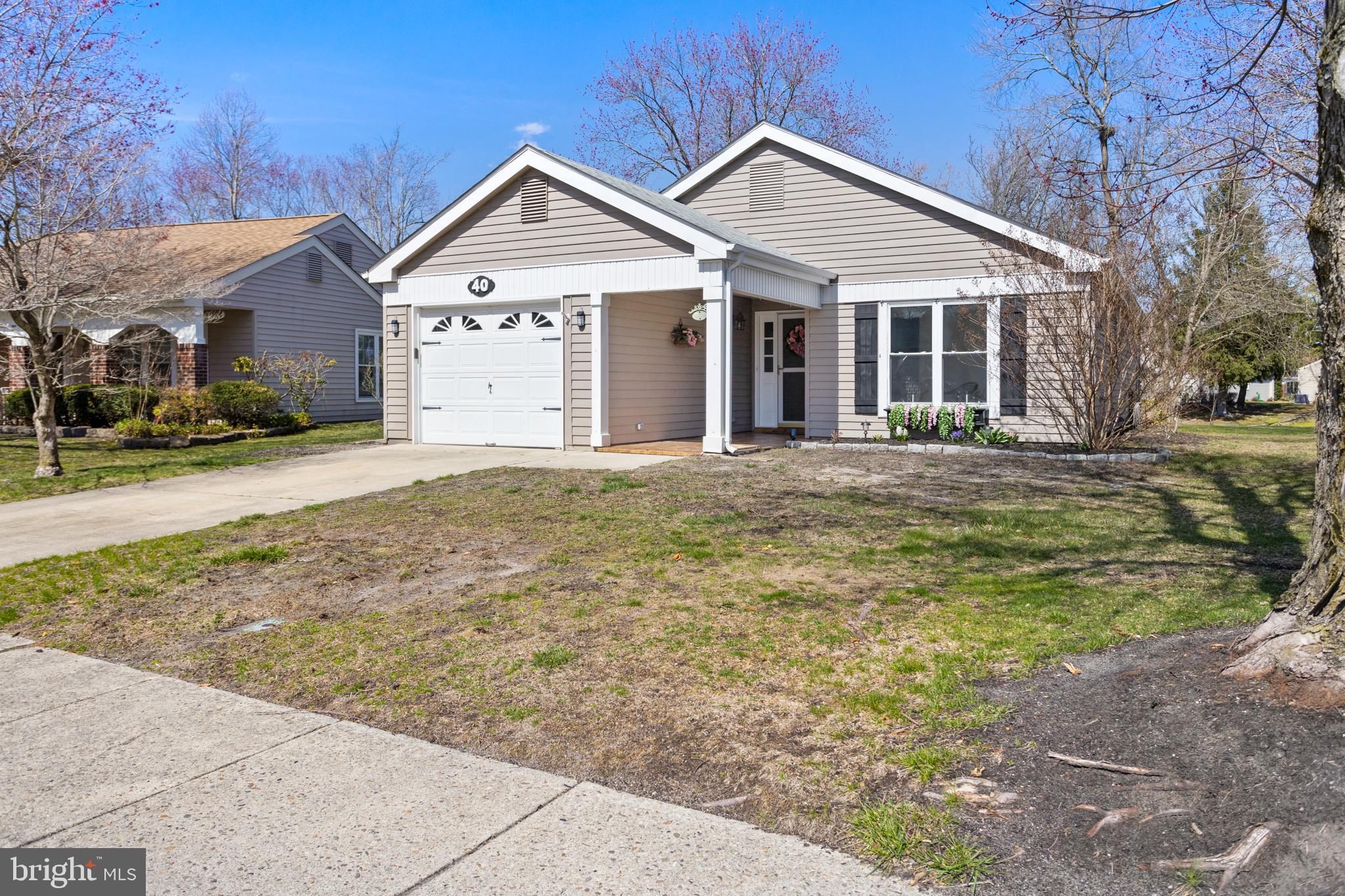 40 Dunstable Road Southampton, NJ 08088 - Photo 2 of 30 a front view of a house with a garden
