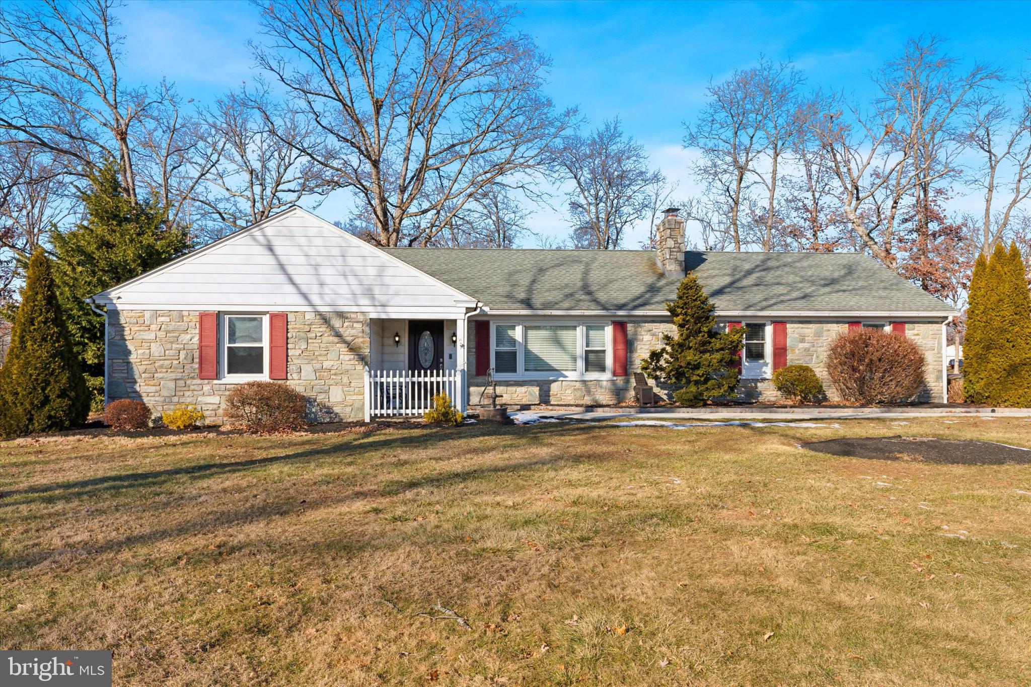 a front view of a house with a yard and a garage