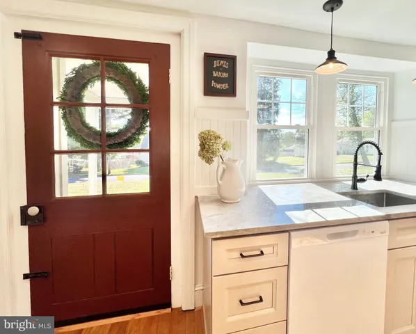 a kitchen with stainless steel appliances granite countertop a stove and a fireplace