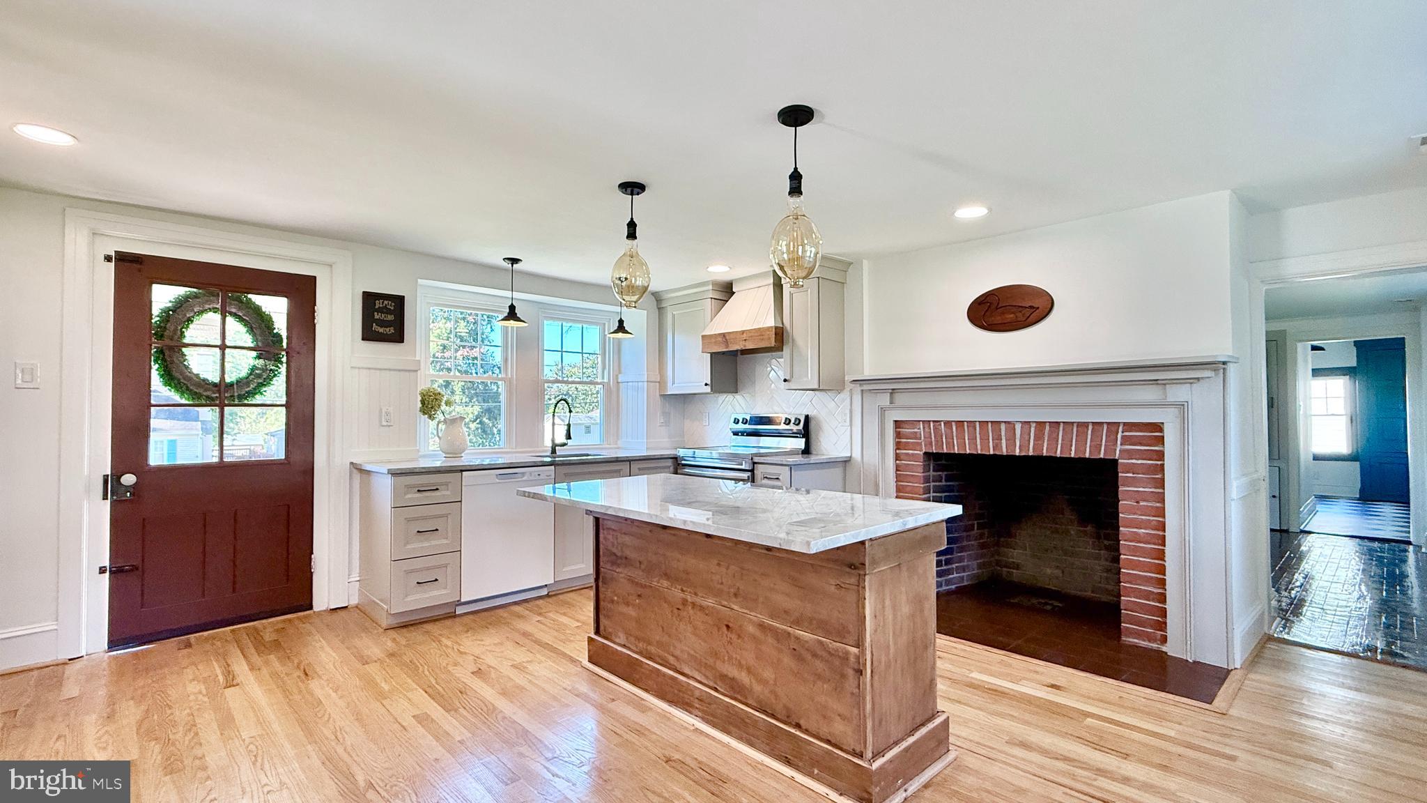 2437 Patane Avenue Abington, PA 19001 - Photo 16 of 69 a kitchen with stainless steel appliances granite countertop a stove and a fireplace