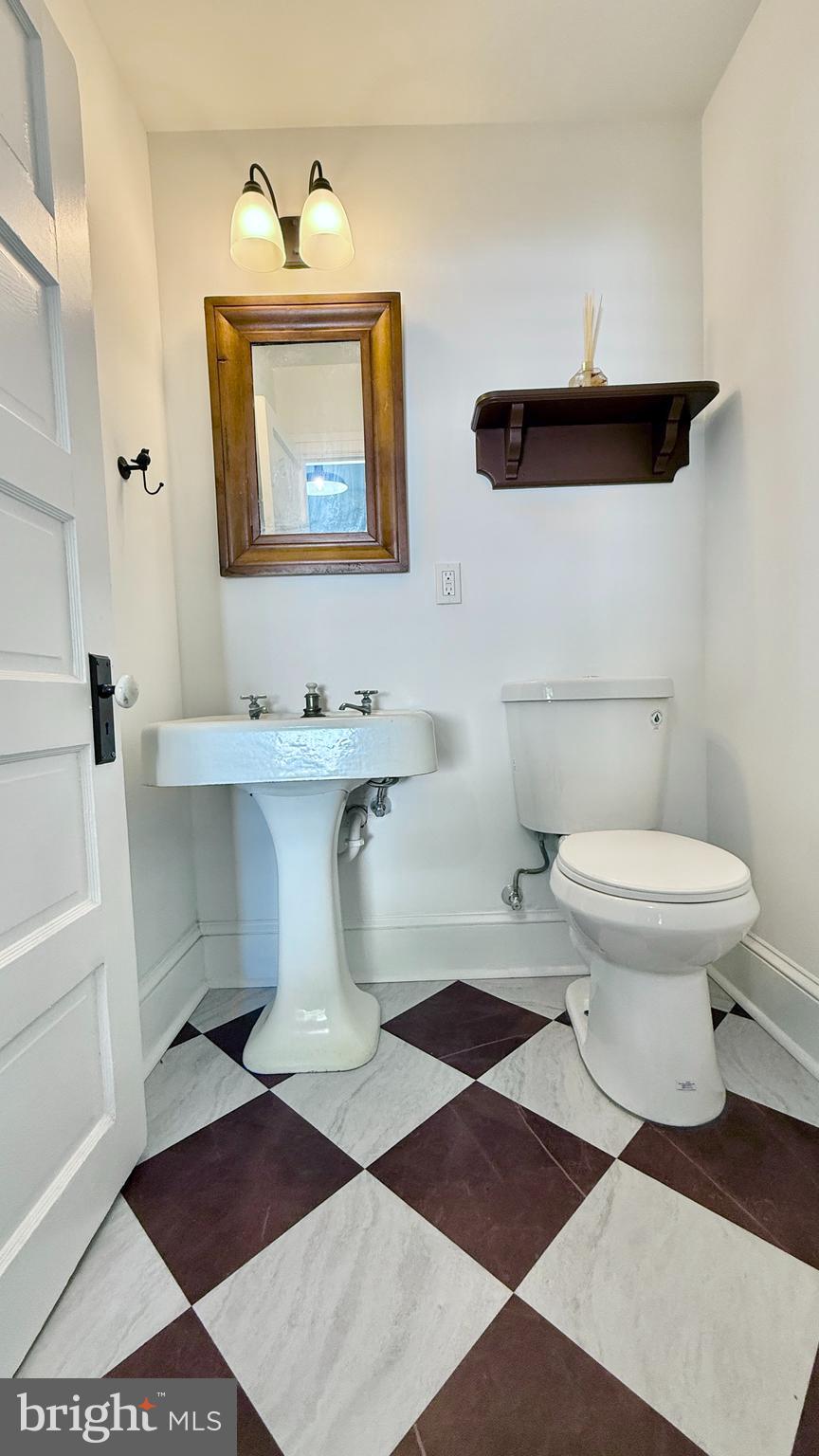 2437 Patane Avenue Abington, PA 19001 - Photo 21 of 69 a bathroom with a toilet a sink and mirror