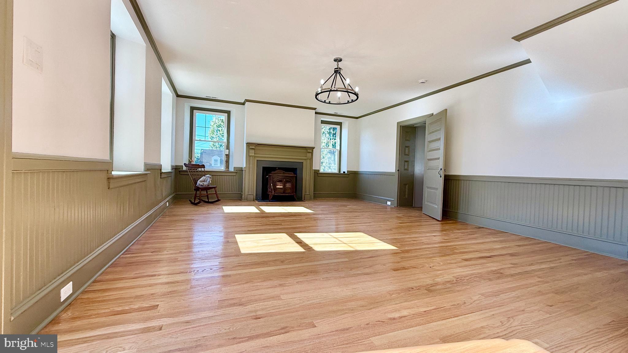 2437 Patane Avenue Abington, PA 19001 - Photo 22 of 69 a view of empty room with wooden floor and fireplace
