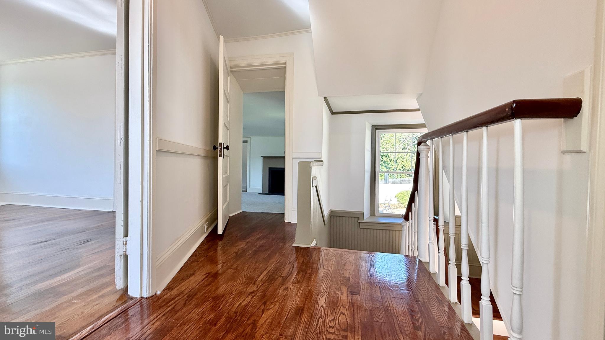 2437 Patane Avenue Abington, PA 19001 - Photo 28 of 69 a view of a hallway with wooden floor and staircase